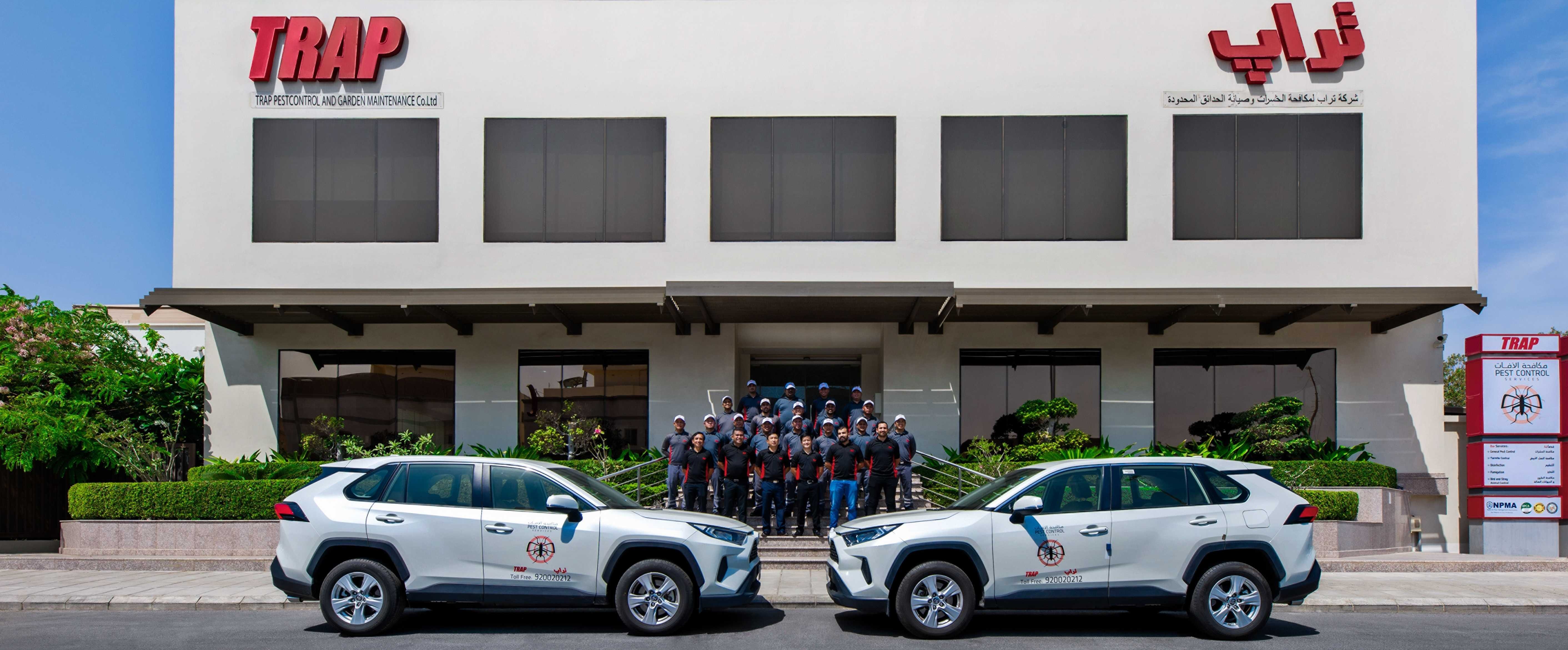 TRAP Pest control employees in front of the company premises