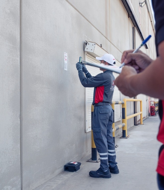 TRAP Pest Control employee inspecting a site and assessing the problem using the monitoring system