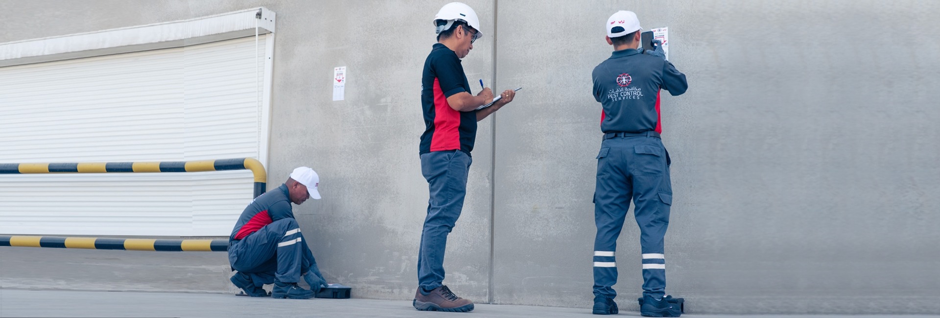 3 experts from TRAP pest control assessing the facility through a monitoring system