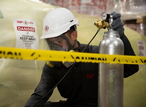 TRAP pest control expert using the fumigation technique to control pests